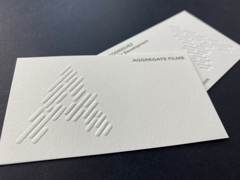 Aggregate Films card with blind-embossed diagonal lines