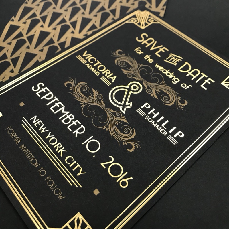 Art-deco gold foil save-the-date on black with patterned envelope