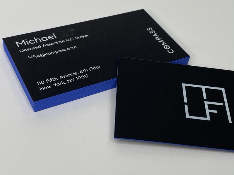 Black business cards with white foil and painted colored edges