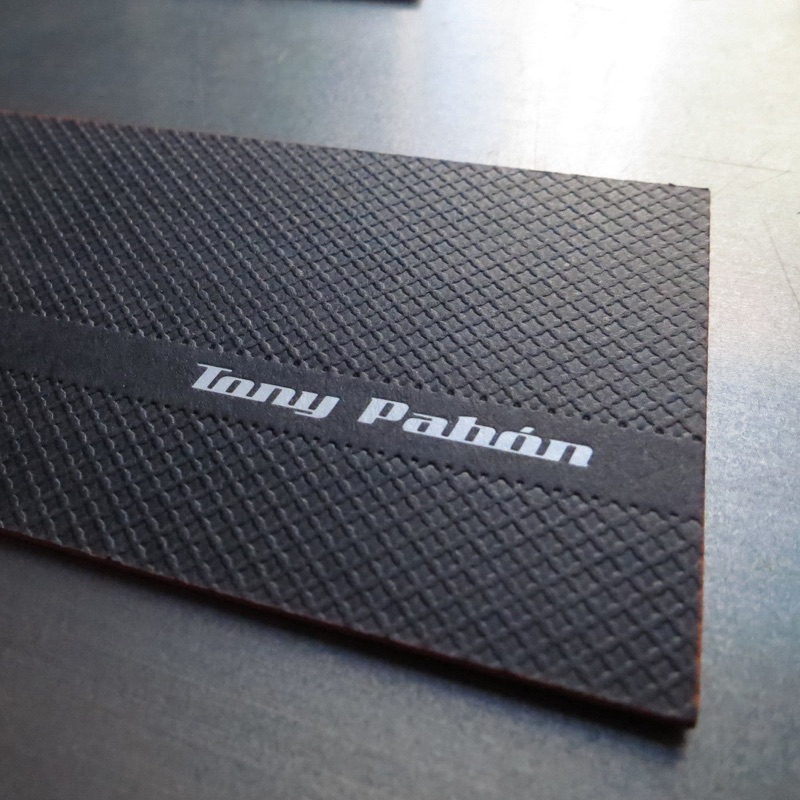 Blind embossed business cards on black paper