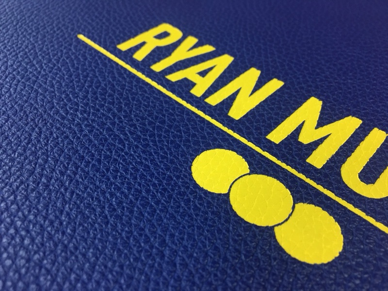 Blue leather book stamped with yellow foil