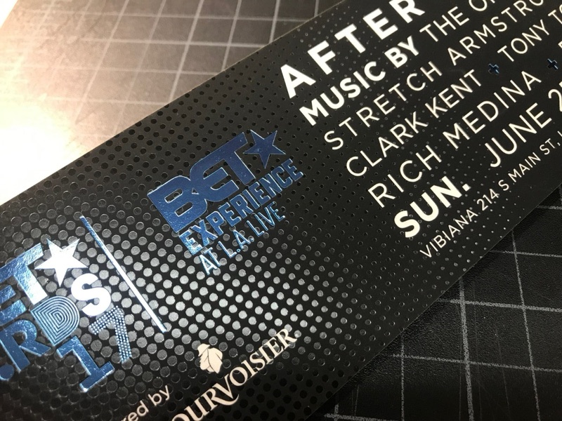 Clear foil stamped invitation on black paper