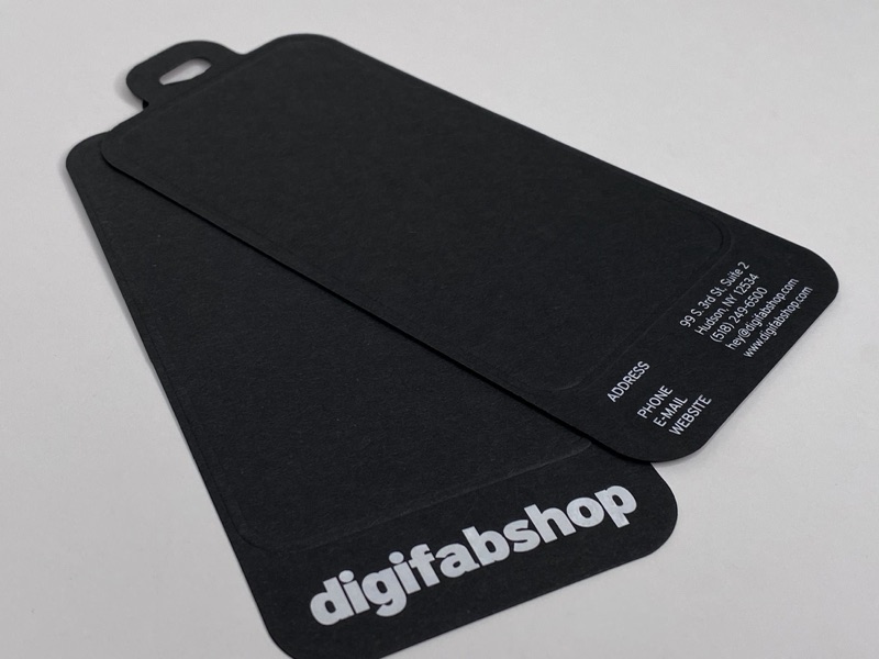 Die cut black paper hang tags with white foil