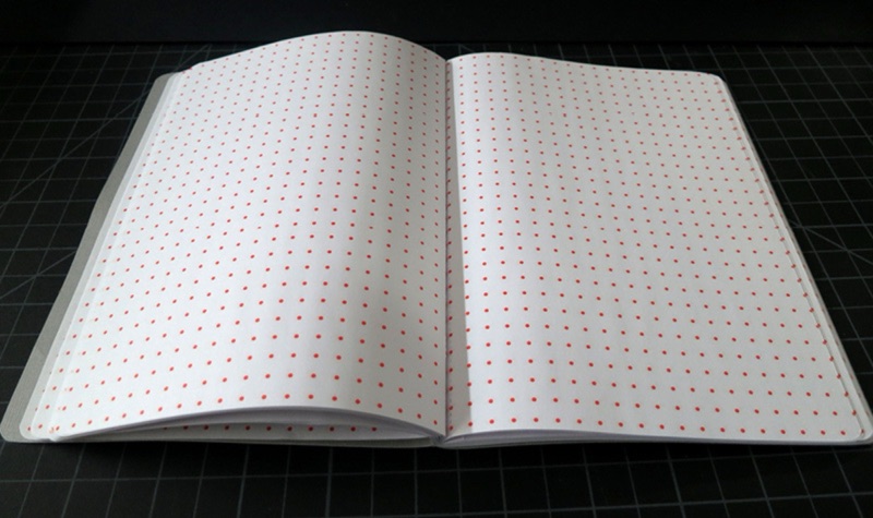 Dot-grid notebook lying open