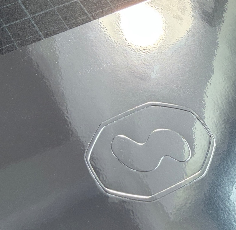 Embossed detail on silver mirror invitation