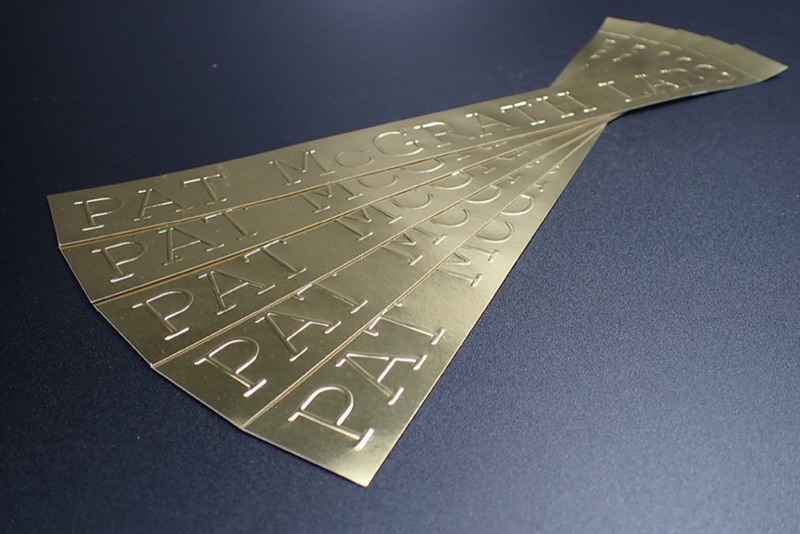 Embossed metallic sticker