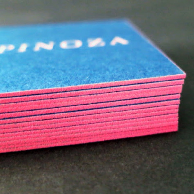 Blue business cards with pink painted edges
