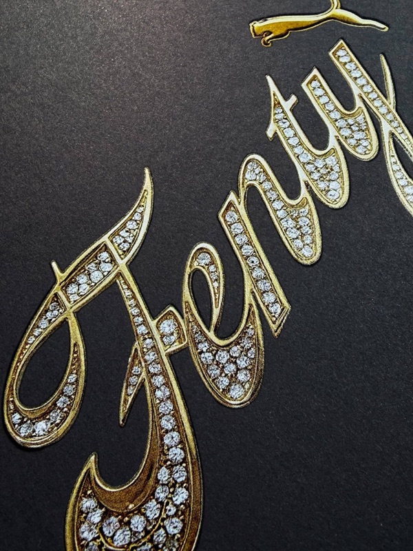 Fenty white ink script on black folder