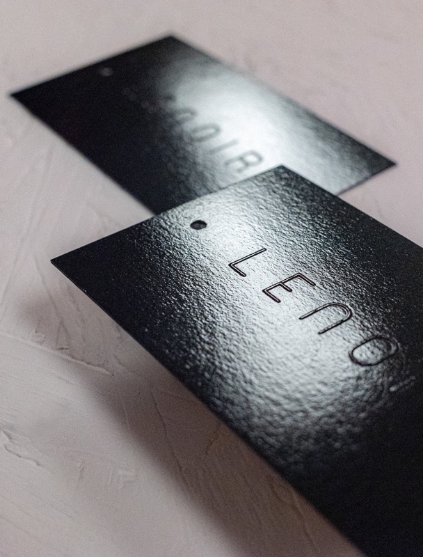 Gloss emboss on black paper hang tags