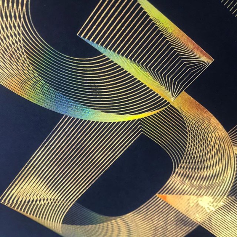 Gold holographic foil linework monogram on navy