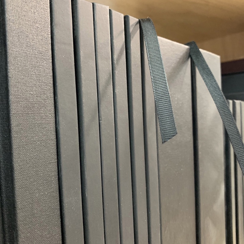 Gray cloth hardcovers with ribbon markers