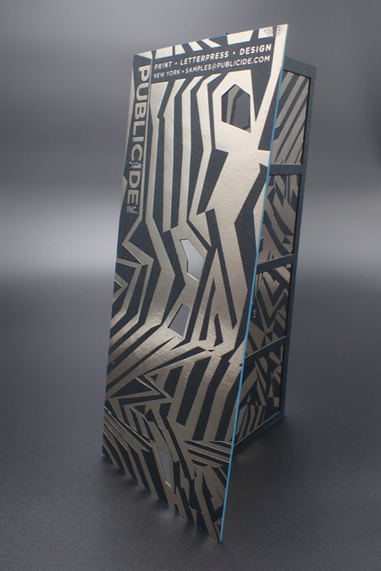 Gunmetal foil stamped pattern on black packaging