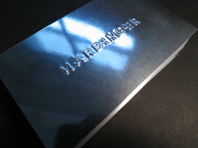 Harbinger business card on silver mirror paper