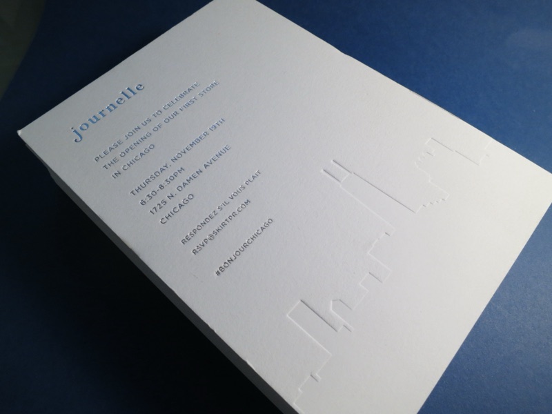 Journelle invitation with debossed city skyline