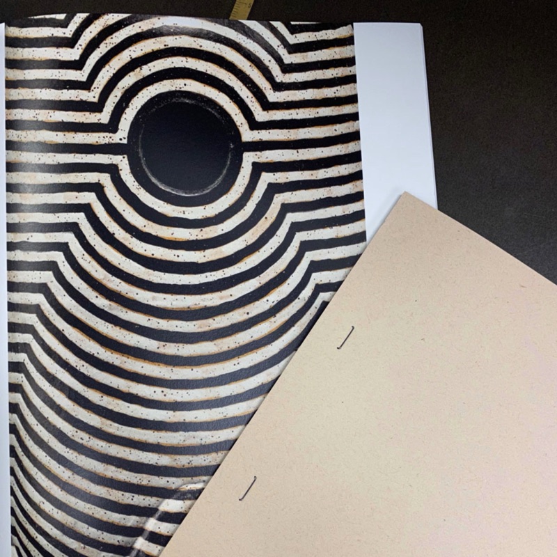 Kraft book cover with op-art circle die-cut