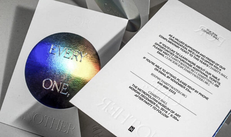 Letterpress event invitations with iridescent foil