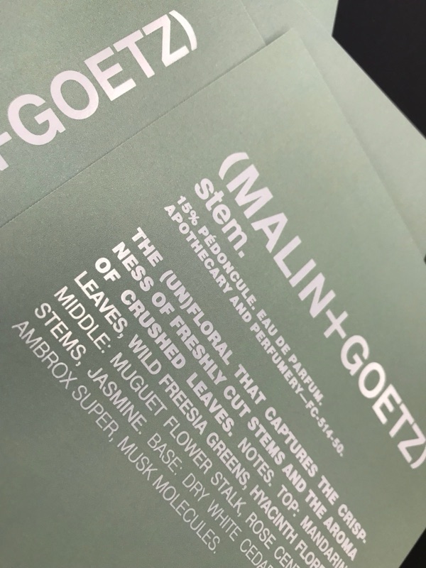 White ink Stem fragrance card for Malin+Goetz