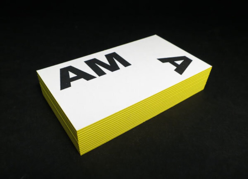 Business card with neon colored edge close-up