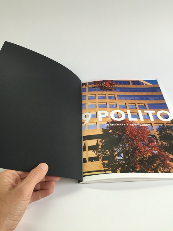 9 Polito property book, black cover opening to full-bleed photography