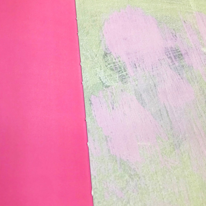 Smyth-sewn hardcover detail in pink cloth
