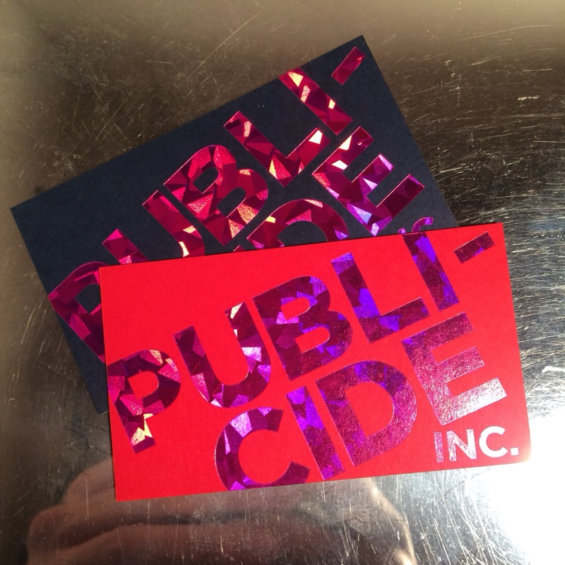 Publicide card with holographic foil letters on red