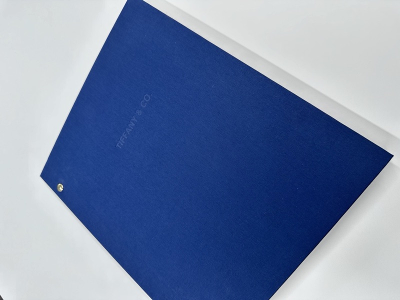 Royal blue booklet with screw-post binding