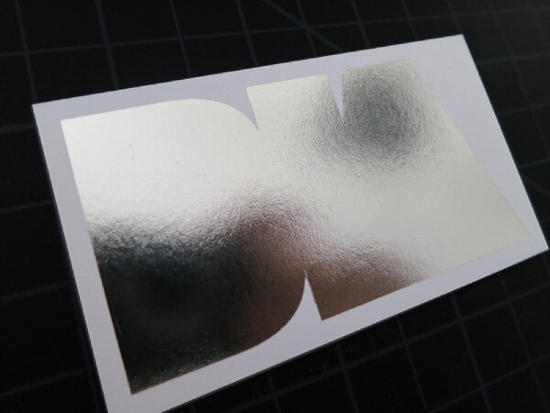 Silver foil stamp with metallic ink on business card