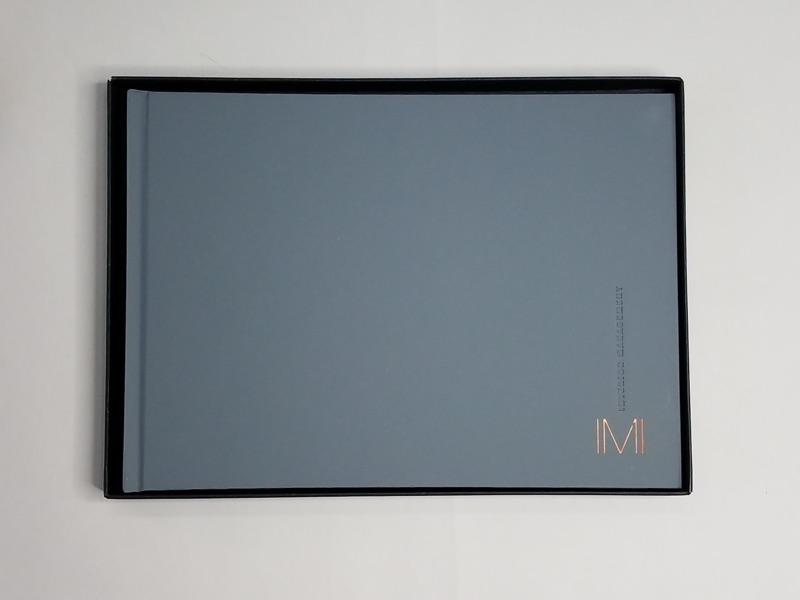 Debossed leather-wrap hardcover with rigid slipcase