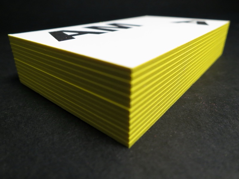 White notecards with yellow painted edges