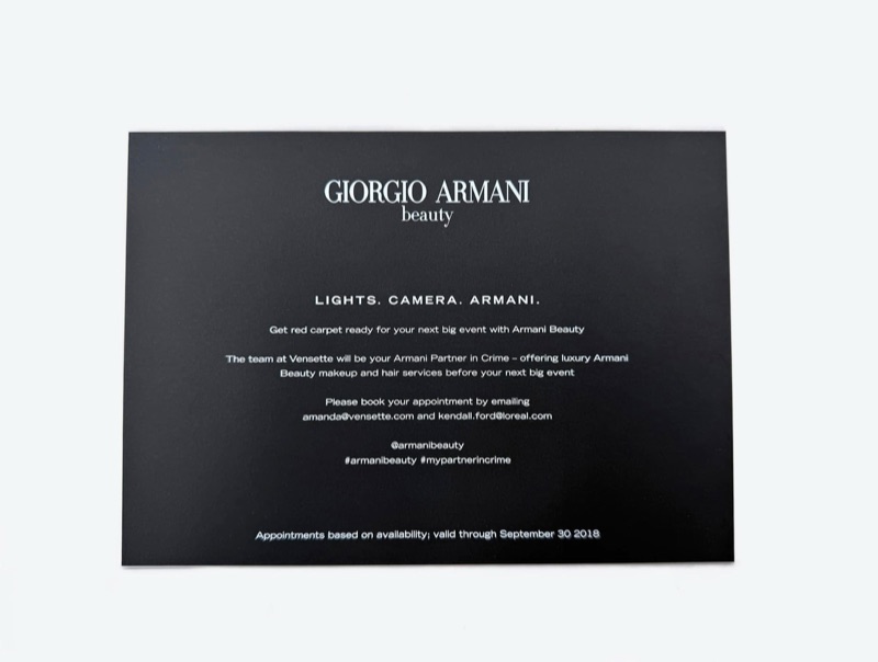 White ink invitation printed on black paper with fine line artwork
