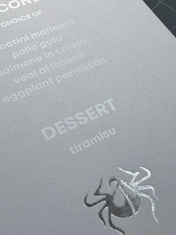 White ink menu on gray paper