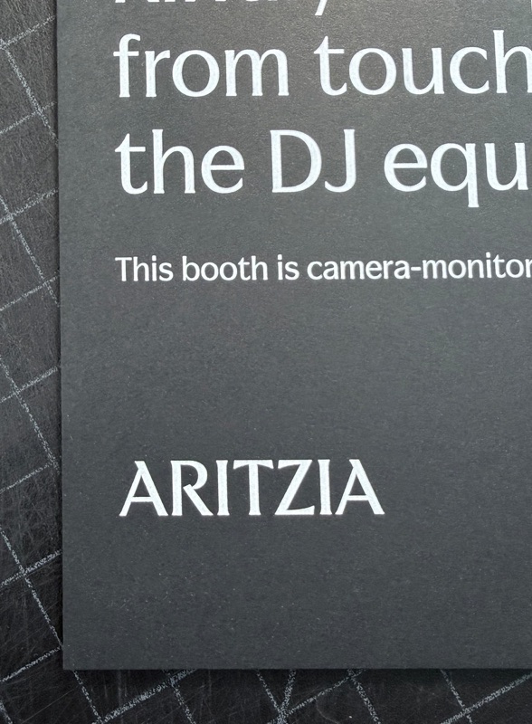 White ink type printed on black paper